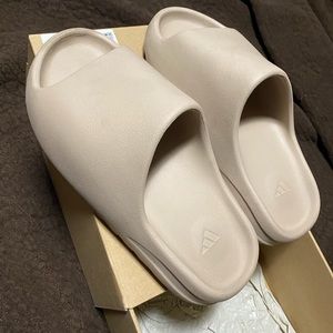 Yeezy Slides in Pure. Size 8 in US Men and fits a size 9 in US Women.